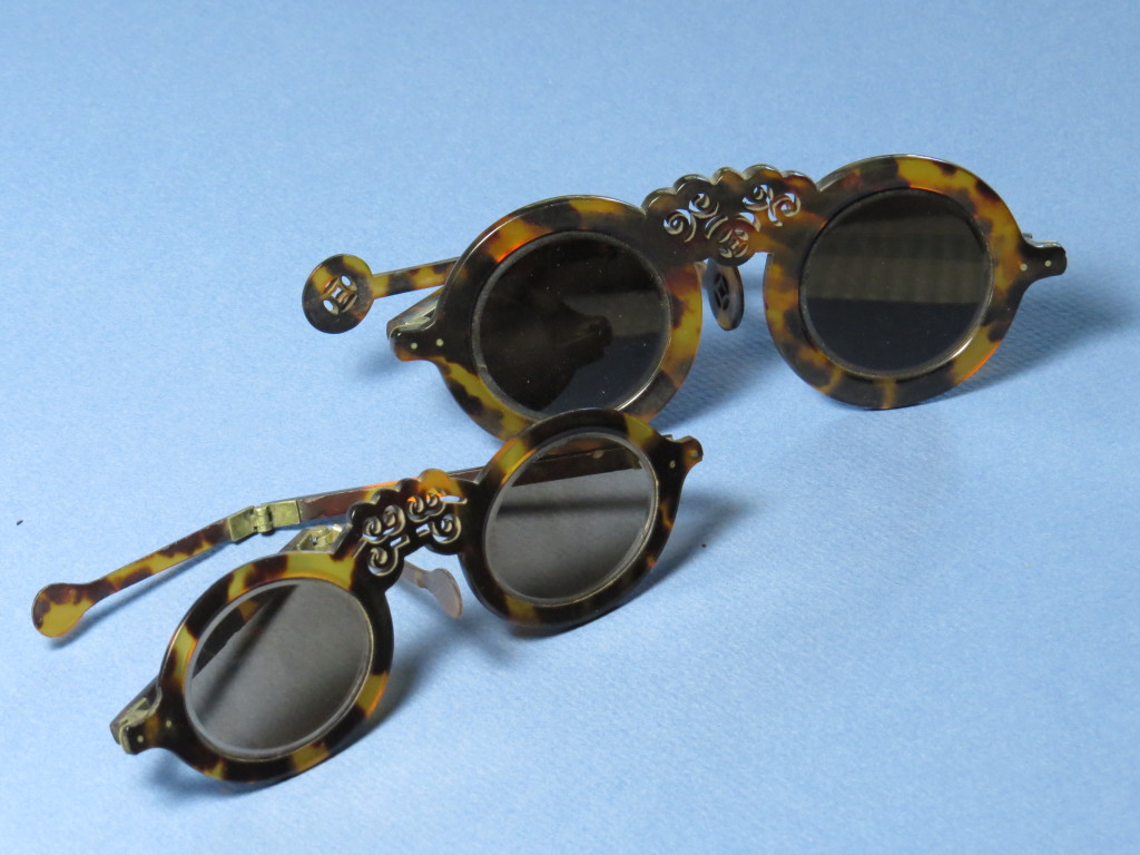 Beautiful hand carved tortoiseshell. Smoked crystal lenses.